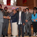 Satnam Singh Sandhu receiving the award from AIAM members