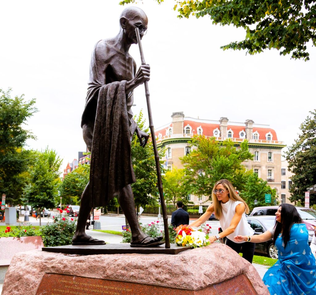 Lara Trump pay respects to the Mahatma Gandhi Statue with AHC's Director Srilekha Palle on October 1, 2020, in Washington, D.C. (Official Campaign Photo by Jonathan D. Williams)