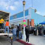 Let Us Share a Meal Volunteers unload a truckload of supplies at a shelter in the Los Angeles fire affected area. Photo: Snaps India via NIT