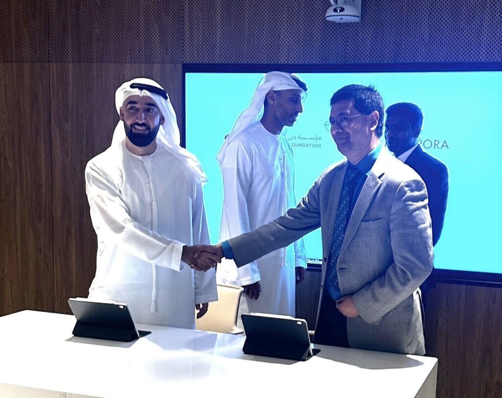 Indiaspora's Executive Director Sanjeev Joshipura signing a MoU with Deputy CEO of Dubai Future Foundation, Abdulaziz Aljaziri in October 2024. Satish Sivan, India's CG in Dubai, and Khalfan Belhoul, CEO of Dubai Future Foundation are seen in the background. PHOTO: Indiaspora