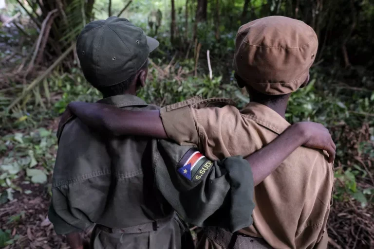 Two children recruited by an armed group stand during a ceremony for children who have been released in Yambio, South Sudan in 2022. Caption and PHOTO: UNICEF