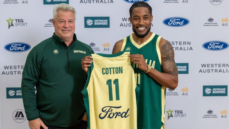 Bryce Cotton is presented with his Australian Boomers jersey by Dean Vickerman, Associate Head Coach of the Boomers, ahead of his national team debut at the FIBA World Cup Asian Qualifiers in Perth. PHOTO: Basketball Australia