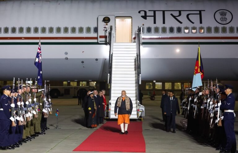 Prime Minister Narendra Modi walking down the red carpet flanked by a guard of honor after arriving in Melbourne on July 8, 2026. PHOTO: X@narendramodi