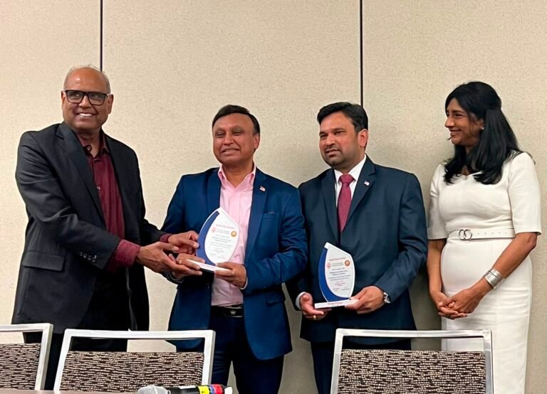 Chief Executive Officer of 22nd Century Technologies, Anil Sharma, and Chief Digital and Information Officer of the U.S. Department of Transportation, Pavan Pidugu being honored by ATA President Jay Challa in the presence of Maryland Lieutenant Governor Aruna Miller on July 31, 2026, at the Baltimore Convention Center in Maryland. PHOTO: ATA