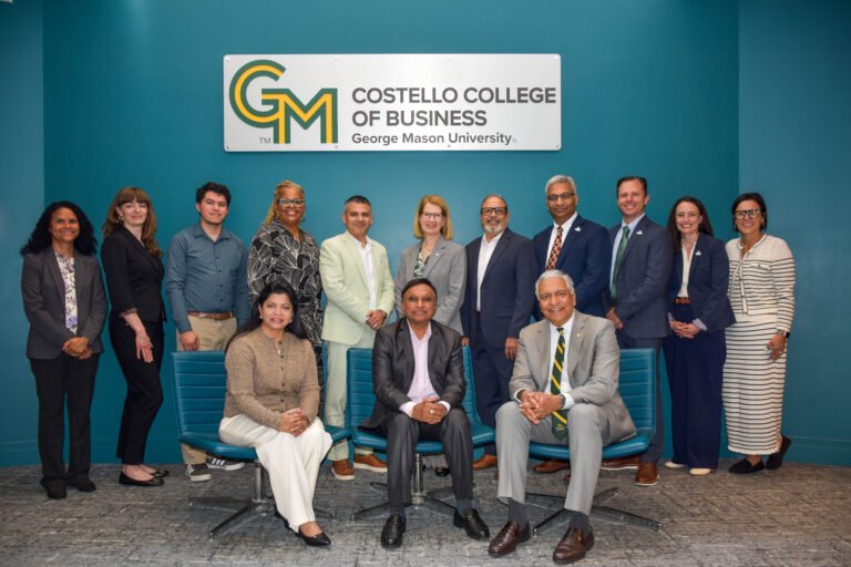 Anupama and Anil Sharma join Costello Dean Ajay Vinzé (front row) and representatives from 22ndCentury Technologies, George Mason University, and the Costello College of Business (second row) for a formal portrait at the conclusion of their tour. PHOTO: Duane Bailey, Costello College of Business.