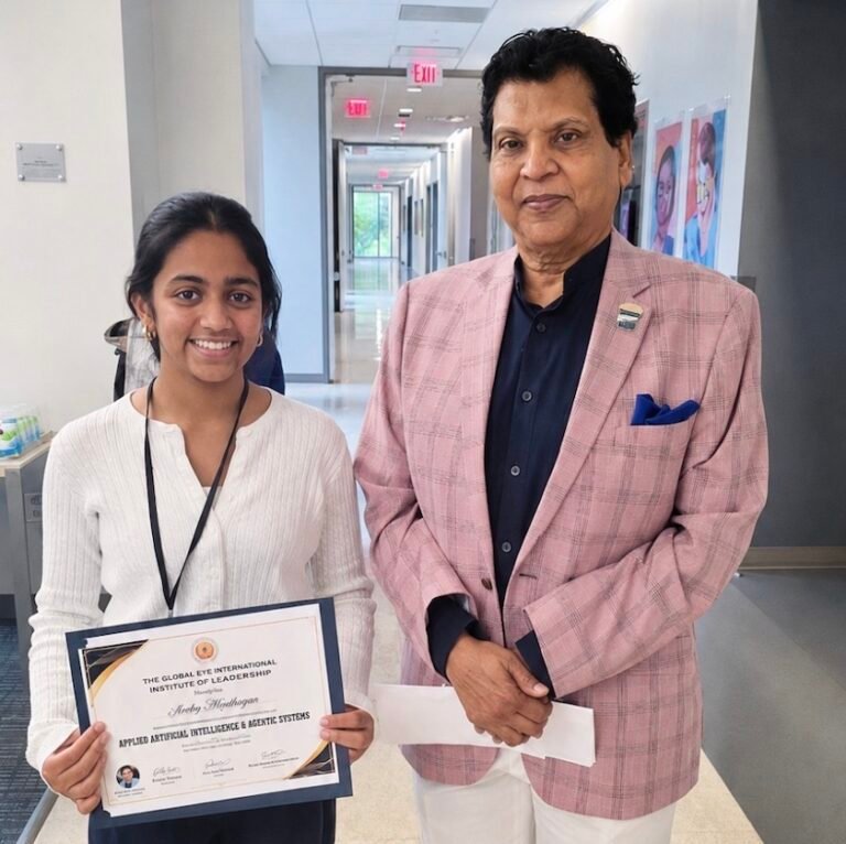 Dr. Vijay Prabhakar, founder and executive chairman of TGEIIL, presenting certificate to a student during the summer program, at North Central College in Naperville. PHOTO: TGEIIL